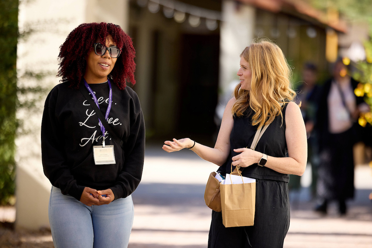 Two women, walking and talking
